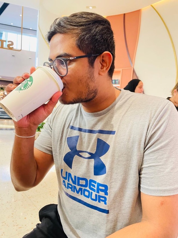 Enura drinking a coffee